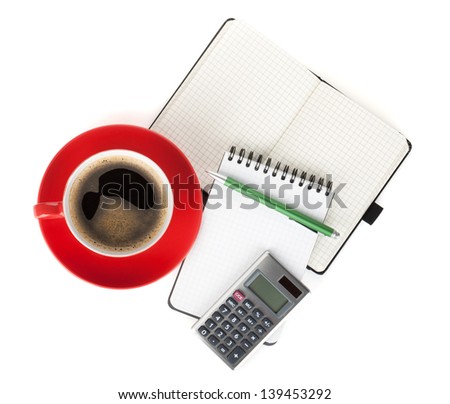 Red coffee cup and office supplies. View from above. Isolated on white background