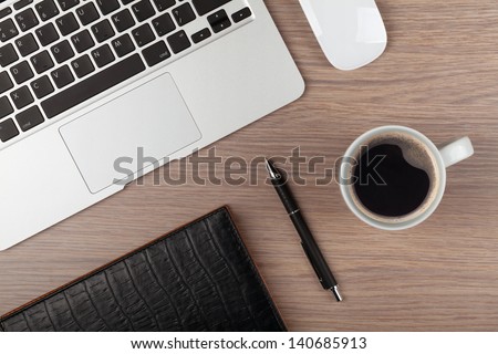Notepad, Laptop And Coffee Cup On Wood Table. View From Above