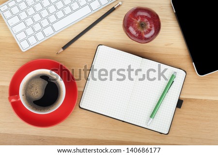 Coffee Cup, Red Apple And Office Supplies On Wooden Table