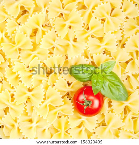 Italian pasta texture with tomato and basil