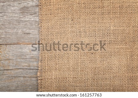 Burlap Texture On Wooden Table Background