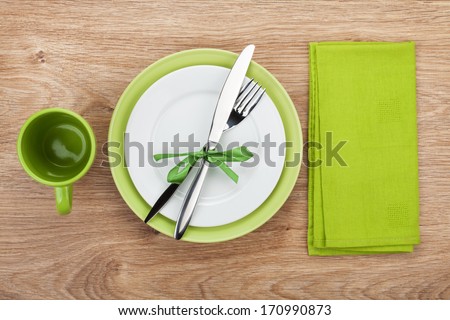 Fork With Knife, Blank Plates, Empty Cup And Napkin. On Wooden Table Background
