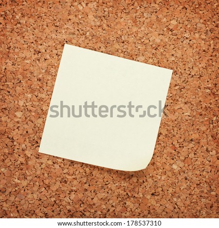 Blank postit note on cork wood notice board with copy space
