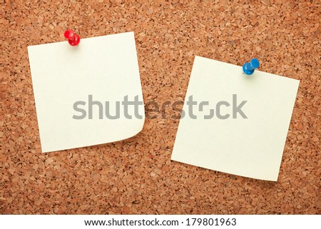 Blank postit notes on cork wood notice board Blank postit notes on cork wood notice board