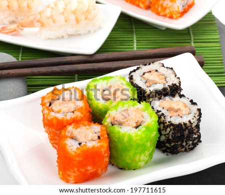 Sushi maki and shrimp sushi on bamboo mat