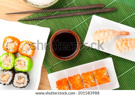 Sushi maki and shrimp sushi on bamboo mat