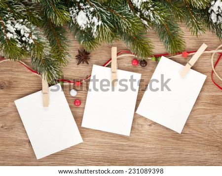 Blank christmas photo frames with fir tree and decor