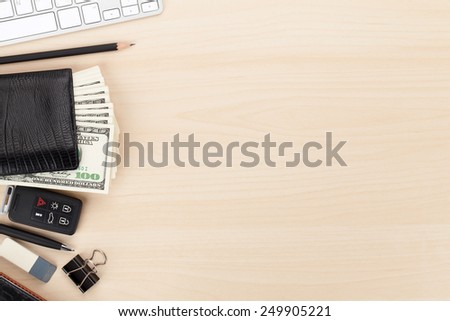 Office table with pc, supplies and money cash. View from above with copy space