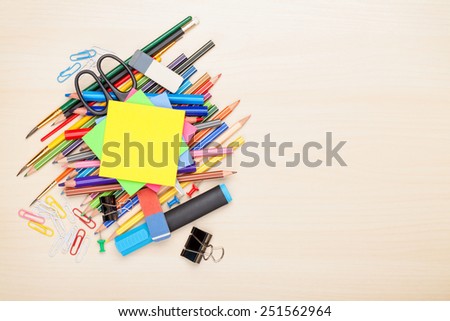 School and office supplies over office table. Top view with copy space