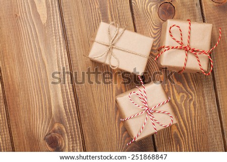 Gift boxes on wooden table background with copy space
