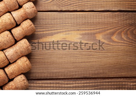 Champagne wine corks over wooden table background with copy space