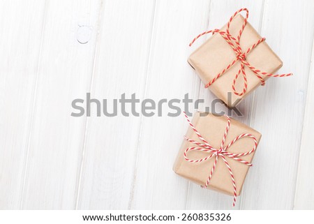 Gift boxes on wooden table background with copy space