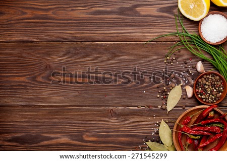 Various spices on wooden background. Top view with copy space