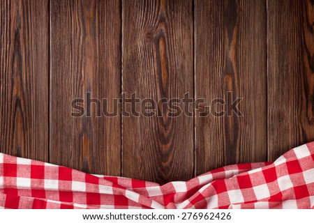 Kitchen table with red towel. Top view with copy space