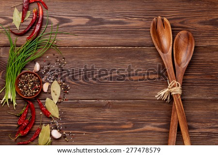 Various spices on wooden background. Top view with copy space
