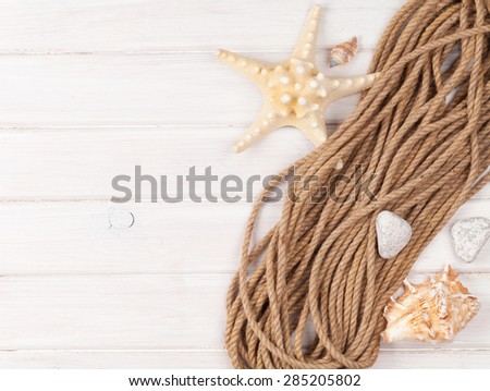 Summer time sea vacation background with star fish, marine rope and copy space