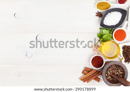Various spices on white wooden background. Top view with copy space