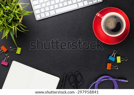 Office leather desk table with computer, supplies, coffee cup and flower. Top view with copy space