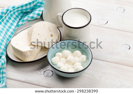 Dairy products on wooden table. Milk, cheese and curd
