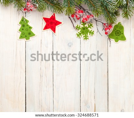Christmas wooden background with fir tree and decor. View from above with copy space