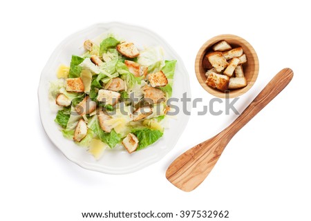 Fresh healthy caesar salad. Isolated on white background. Top view