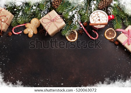 Christmas background with fir tree, hot chocolate and marshmallow. Top view with copy space
