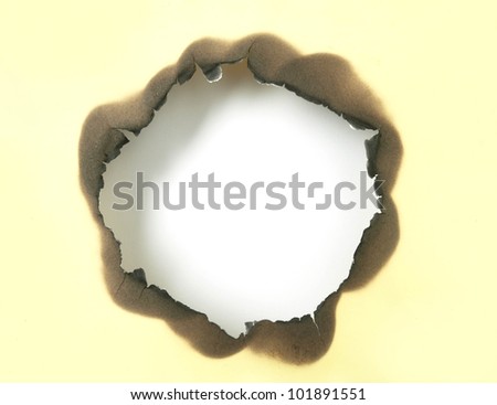 White hole on burnt paper