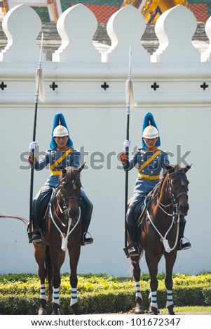 BANGKOK - DECEMBER 5, 2010:  Two members of an elite squad, the Thai Royal Mounted Guard stand in formation at the King's birthday parade on December 5, 2010 in Bangkok