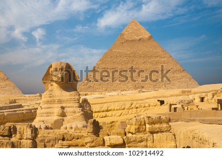 A beautifully clear blue sky behind the Sphinx and Khafre Pyramid side by side in Giza, Cairo, Egypt