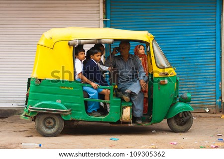 Delhi, India - Oct. 27:Unidentified Children Wait To Be Transported To School In A Private Auto Rickshaw On October 27, 2009 In Delhi, India. Schools Do Not Provide Shared Bus Transportation In India.