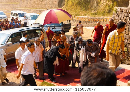DHARAMSALA, INDIA - JUNE 25: A phalanx of men surround his Holiness, the Dalai Lama on his way to a speech, on June 25, 2009 in Dharamsala, India