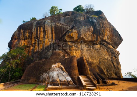 The second level stairs and entrance to the former fortress and monastery of Sigiriya rock, guarded by a pair of lion feet in Sri Lanka