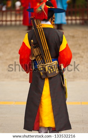 SEOUL, KOREA - AUGUST 27, 2009: A soldier in ancient costume stands at the entry Deoksugung Palace, a tourist landmark, for changing of the guards ceremony in Seoul, South Korea on August 27, 2009