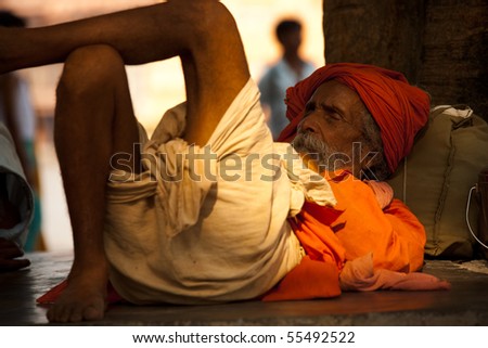 HARIDWAR, INDIA - MAY 21: A sadhu naps under a shady tree May 21, 2009 in Haridwar, India.