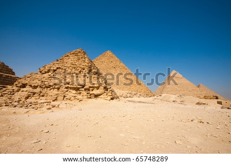 A unique perspective of all of the pyramids of Giza beginning at the smallest, the Queen\'s Pyramids and ending at the largest, the Pyramid of Cheops