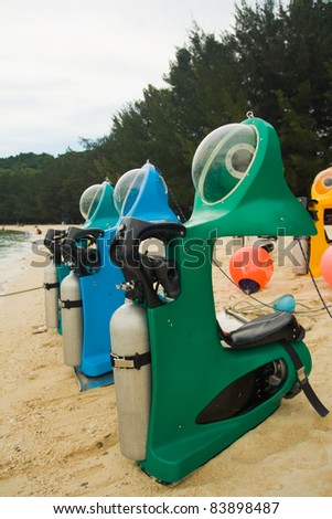 Personal recreational underwater submarine scooters wait on a beach ready for tourist riders to enjoy underwater marine life