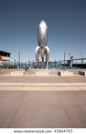 SAN FRANCISCO - OCT 2: A temporary art installation, the Raygun Gothic Rocketship stands on a busy tourist promenade along the San Francisco Bay June 6, 2009 in San Francisco, California, USA