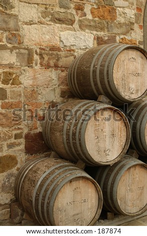 Barrels stacked against a wall, Baidia a Passignano, Tuscany, Italy,
