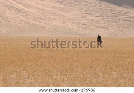 Man walking in the desert, Namibia, Africa