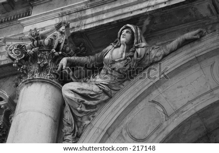 Low angle view of a sculpture mounted on an arched entrance, Venice, Italy (black and white)