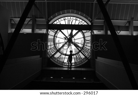 Rear view of a person looking at the inside of a clock tower, Paris, France (black and white),