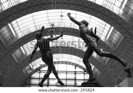 Low angle view of nude sculptures of two male athletes, Paris, France (black and white),