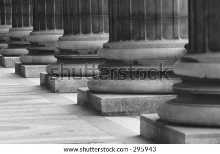 Close-up of the bases of an array of pillars, Paris, France (black and white),
