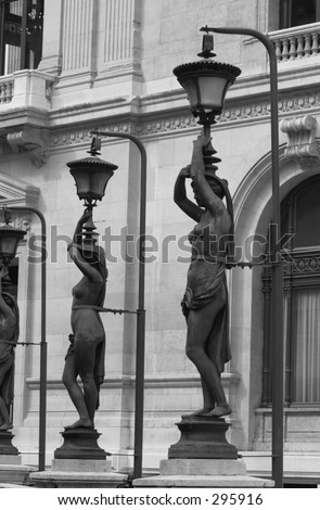 Side profile of iron statues of women designed as lampposts, Paris, France (black and white),