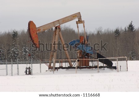 Oil Well in Field of Snow in Alberta Canada