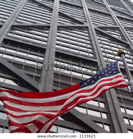 Low angle view of the American flag outside John Hancock Building in Chicago