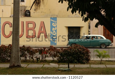 Side profile of a vintage car on an empty street, Havana, Cuba