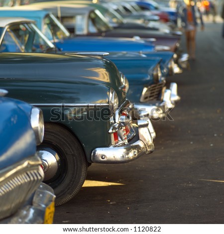 Array of antique taxi cabs parked, Havana, Cuba