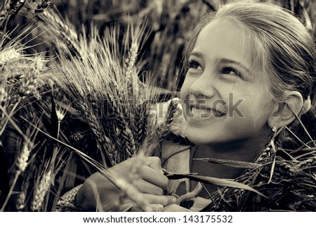 Girl with wheat spikelets. black-and-white photo