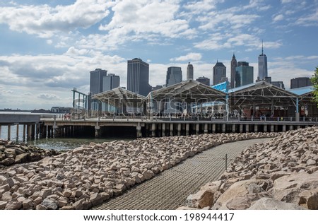 NEW YORK - JUNE 14: Manhattan Skyline from across the East River on June 14, 2014 in New York. The East River is a tidal strait that connects Upper New York Bay to Long Island Sound.